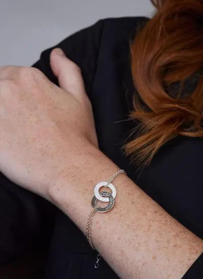 Close up of red haired model wearing Sterling Silver Croi Alainn Double Bracelet  